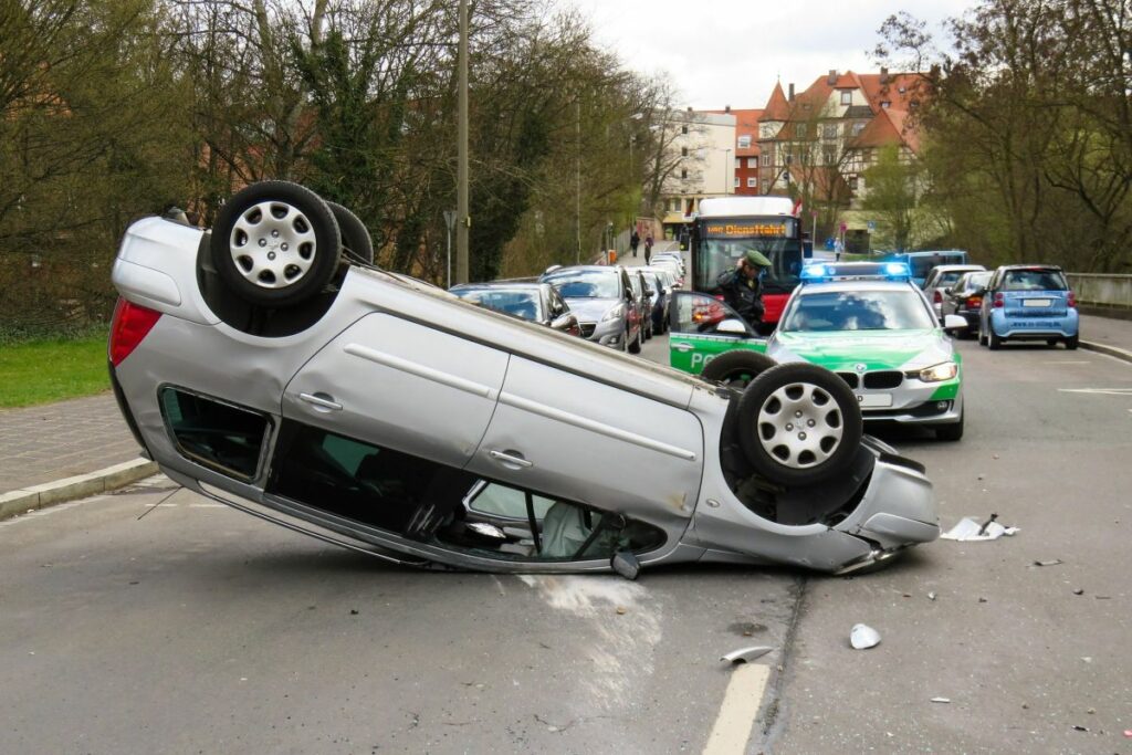 Car accident resulting in a car being overturned.