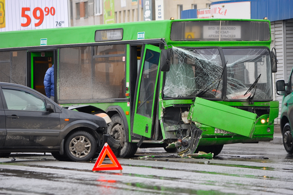 Bus and car collide.