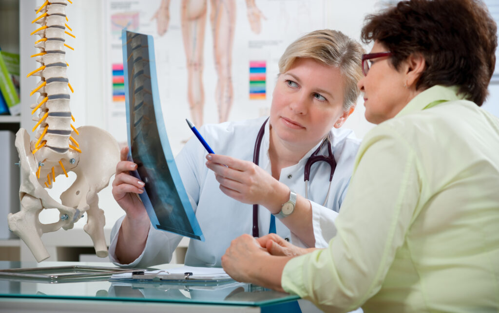 Doctors reviewing x-rays prior to performing surgery.