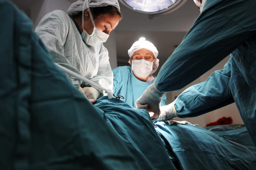 Doctors and nurses working on a serious surgery.